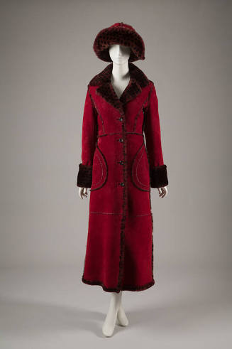 Dark red calf length coat trimmed with light red spotted fur on collar, cuffs, and on matching …