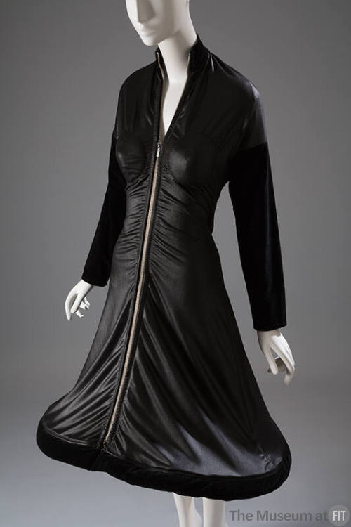 Black long sleeve zip front dress with velvet trim and hoop hem