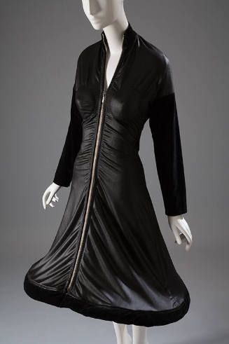 Black long sleeve zip front dress with velvet trim and hoop hem