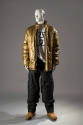 Gold puffer jacket over white t-shirt with H logo and black quilted pants 