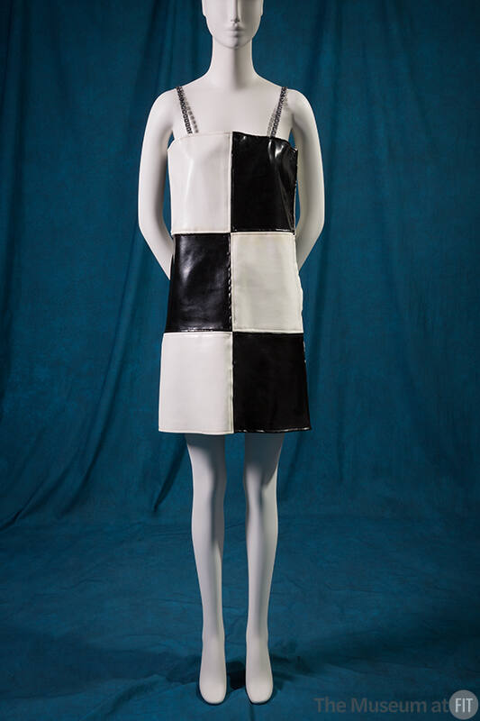 Black and white checkerboard vinyl mini dress with thin shoulder straps 