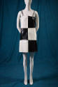 Black and white checkerboard vinyl mini dress with thin shoulder straps 