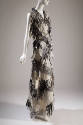 Black and white sleeveless floor length dress with woven sections and fringe