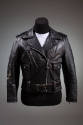 Black motorcyle jacket with silver zippers and snaps; coordinating black belt with large silver…