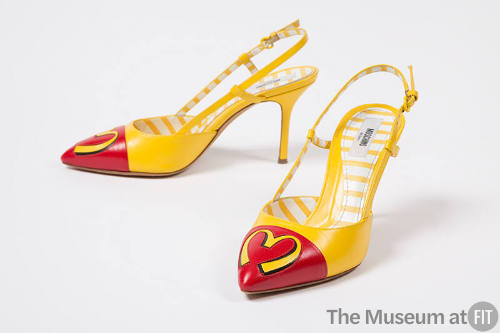 yellow pumps and a yellow "M" on red toebox