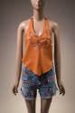 Orange leather halter top with burnished fairy and flower design and denim cut off shorts cover…