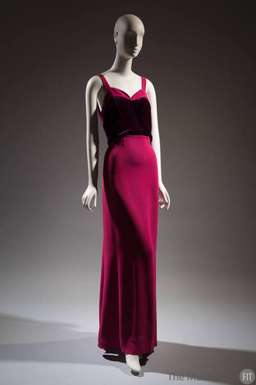 Dark pink sleeveless floor length evening dress with camisole straps, sweetheart neckline and p…