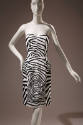 Black and white zebra print strapless knee length dress with sweetheart neckline and fitted bon…