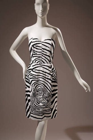 Black and white zebra print strapless knee length dress with sweetheart neckline and fitted bon…