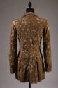 Back view of jacket in brown and beige floral pattern reverse applique and slightly flared from…