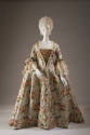 Ivory brocade robe a la francaise dress with red, peach, pink, blue and green floral and leaf p…