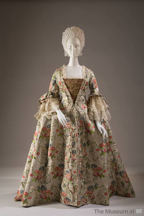 Ivory brocade robe a la francaise dress with red, peach, pink, blue and green floral and leaf p…