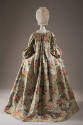 Back view of ivory brocade robe a la francaise dress showing large pleat at center from neck to…