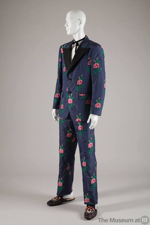 Man’s blue formal suit with allover woven red, pink and green stemmed roses, jacket with black …