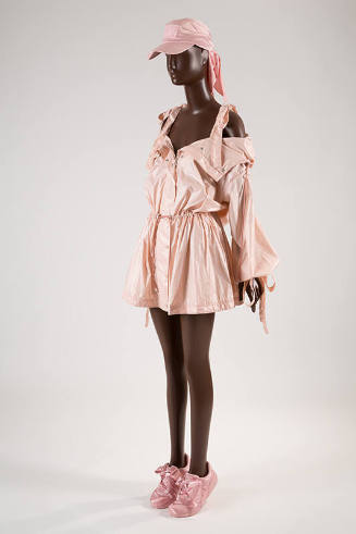 Pink nylon jacket with off-the-shoulder sleeves and bow tied camisole straps and gathered draws…