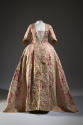 Pink with ivory and green floral print robe a la francaise gown shown without bodice panel and …