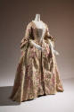 ¾ view of pink robe a la francaise gown showing white lace sleeve flounces 