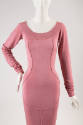Detail view of pink dress showing ribbed scoop neck, ruched long sleeves and princess seaming t…