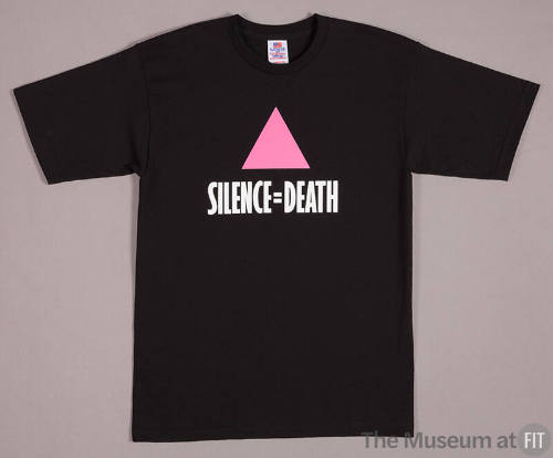 Black short sleeve t-shirt with pink triangle and white text reading Silence = Death on center …