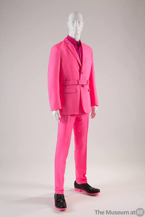 Man’s neon pink suit with belted single breasted jacket, matching slim pants, fuchsia pink shir…