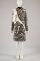 Black and white zebra print coat with white patch pocket cross body bag, white sneakers and ear…