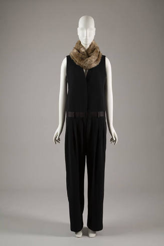Black sleeveless jumpsuit with satin waistband and faux fur neck warmer