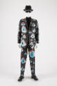 Man’s dark blue suit with allover painted orange, blue, gold, white and black eyes of various s…