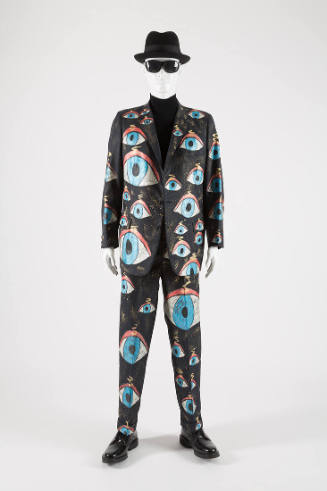Man’s dark blue suit with allover painted orange, blue, gold, white and black eyes of various s…
