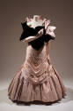 Light pink floor length evening dress with chevron pleating from bodice to below knee, full ple…
