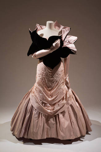 Light pink floor length evening dress with chevron pleating from bodice to below knee, full ple…