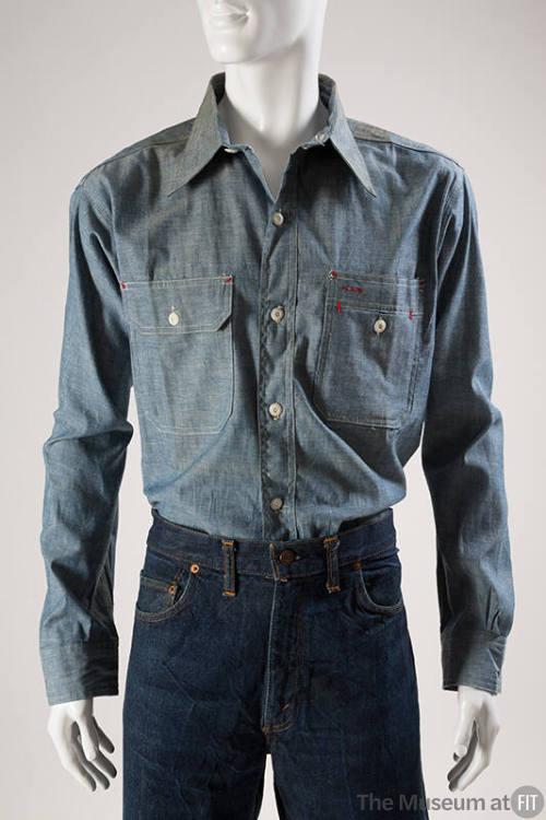 Blue denim long sleeve tailored shirt with button front, two buttoned patch pockets and red sti…