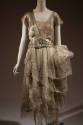 Silver lamé cap sleeve v-neck dress with embroidered net and chiffon camisole and layered skirt…
