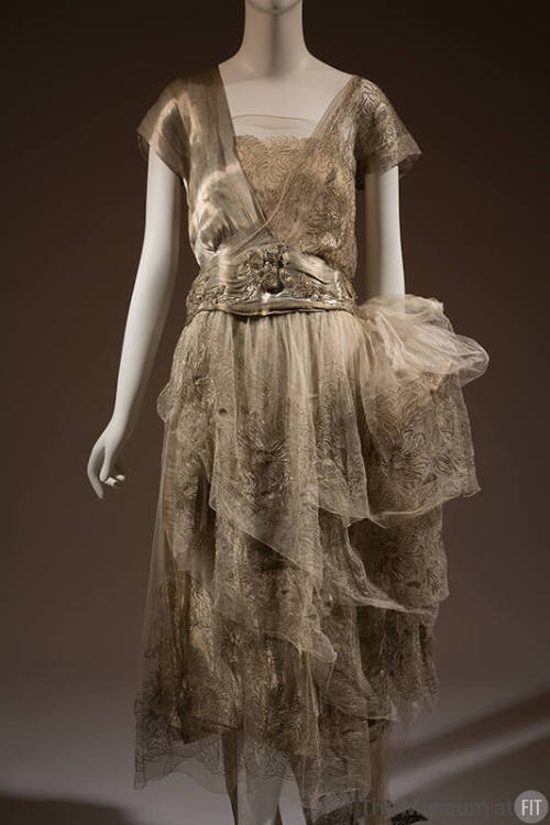 Silver lamé cap sleeve v-neck dress with embroidered net and chiffon camisole and layered skirt…