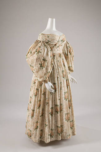 Off the shoulder, off-white day dress with floral print, long puffed sleeves, and long gathered…