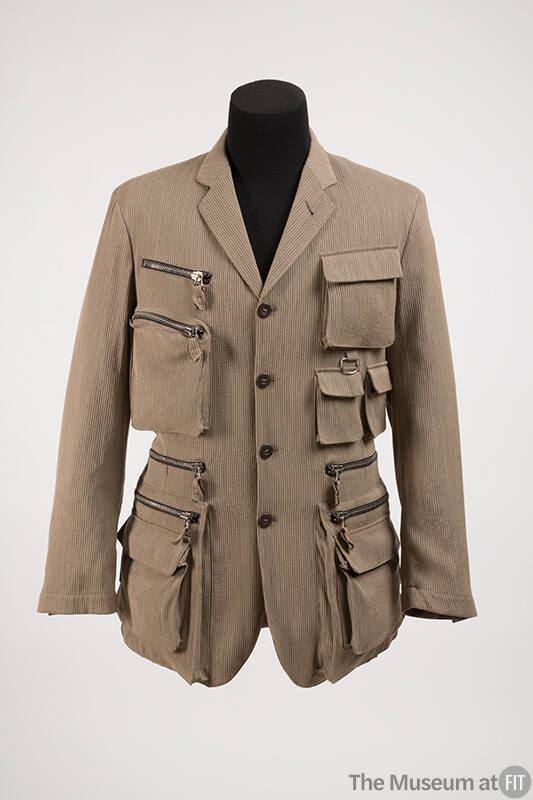 Beige herringbone long sleeve button front jacket with grey pinstripes and multiple zipper and …