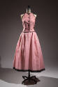 Sleeveless pink and white stripe button front vest and full skirt with black trim 