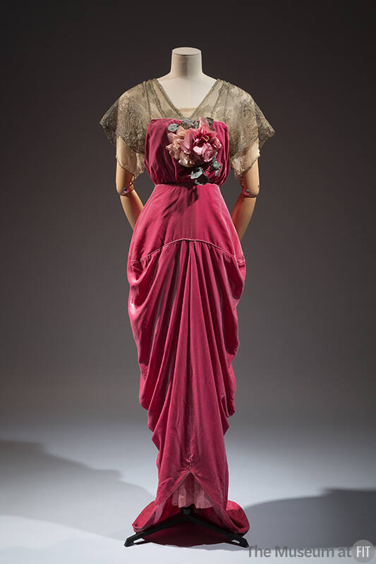 Dark pink floor length evening dress with gold metallic short sleeves, pink flowers on center b…