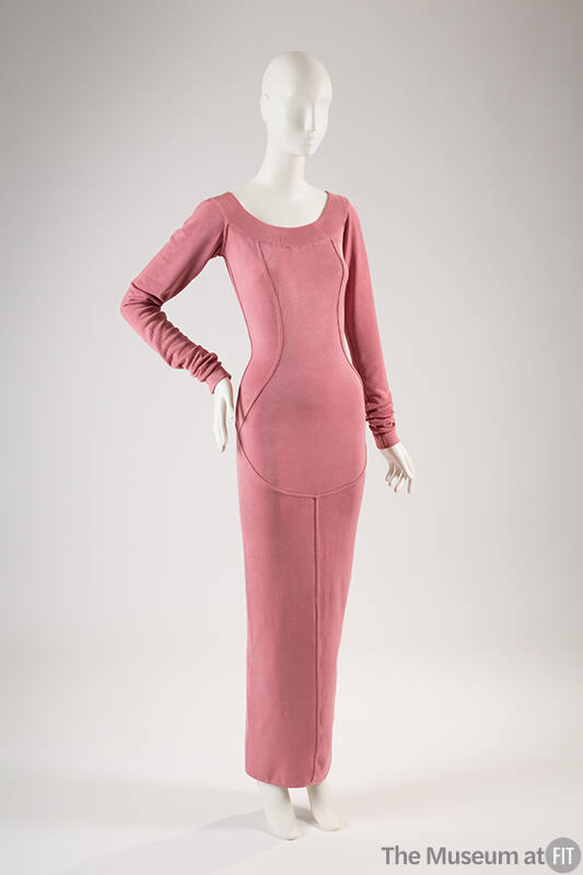 Pink fitted ankle length evening dress with long sleeves, scoop neck and princess seaming that …