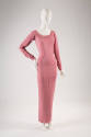 Pink fitted ankle length evening dress with long sleeves, scoop neck and princess seaming that …