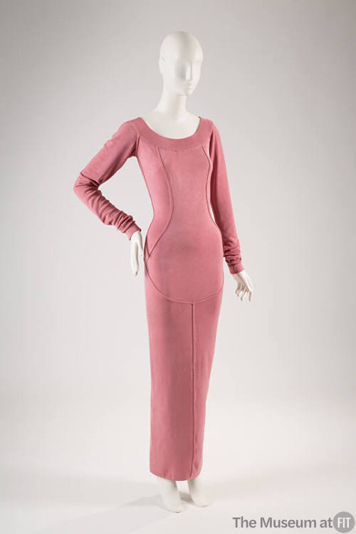 Pink fitted ankle length evening dress with long sleeves, scoop neck and princess seaming that …