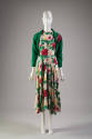 Ivory dress with red, yellow, orange, purple, pink, green floral print, below-the-knee length c…