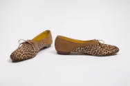 Pair of tan, leapord print flats with an oval toe