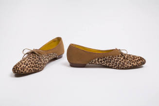 Pair of tan, leapord print flats with an oval toe