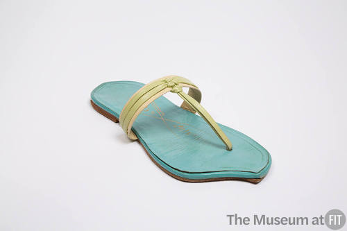 Blue leather thong sandal with light green and beige knotted instep band and front footbed diag…