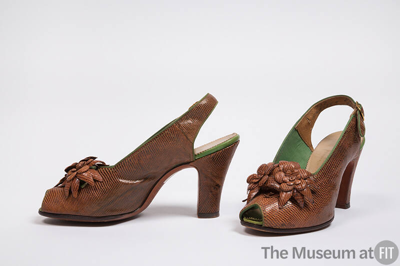 Pair of brown lizard high heel slingback sandals with open toe and molded flowers on vamp