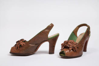 Pair of brown lizard high heel slingback sandals with open toe and molded flowers on vamp