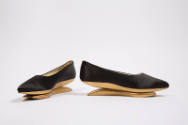 Pair of black pumps with gold painted wood platform rocker sole