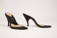 Pair of black high heel shoe soles with no tops and Herbert Levine logo visable on sole