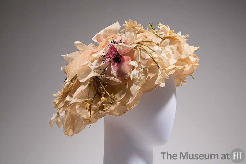 Large hat of light pink rose petals covered in flowers