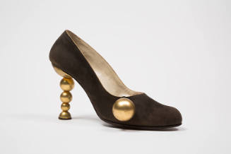 Brown evening pump with sculpted high heel of gold metal graduated balls, and pendant gold ball…